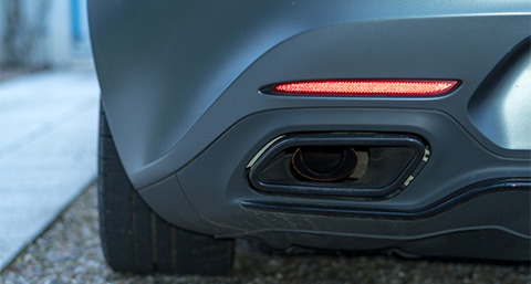 the back bumper of a sports car with a matte texture