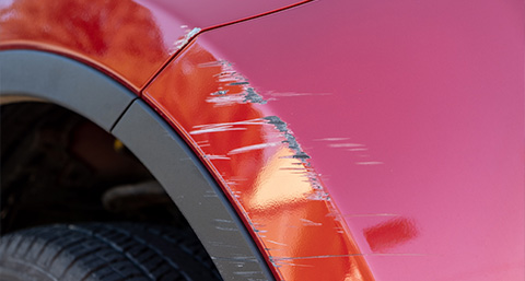 a wheel arch with a scuff from a collision or scrape