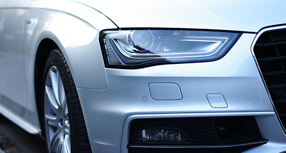 the front bumper of a car with a shiny texture